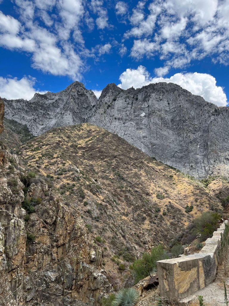 the steep cliffs of marble stand in the distance